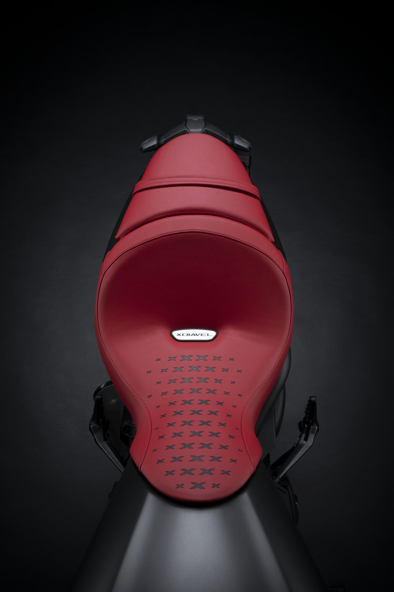 Rear view of the Ducati XDiavel tail unit upholstered in red Pelle Frau® leather with X-pattern stitching