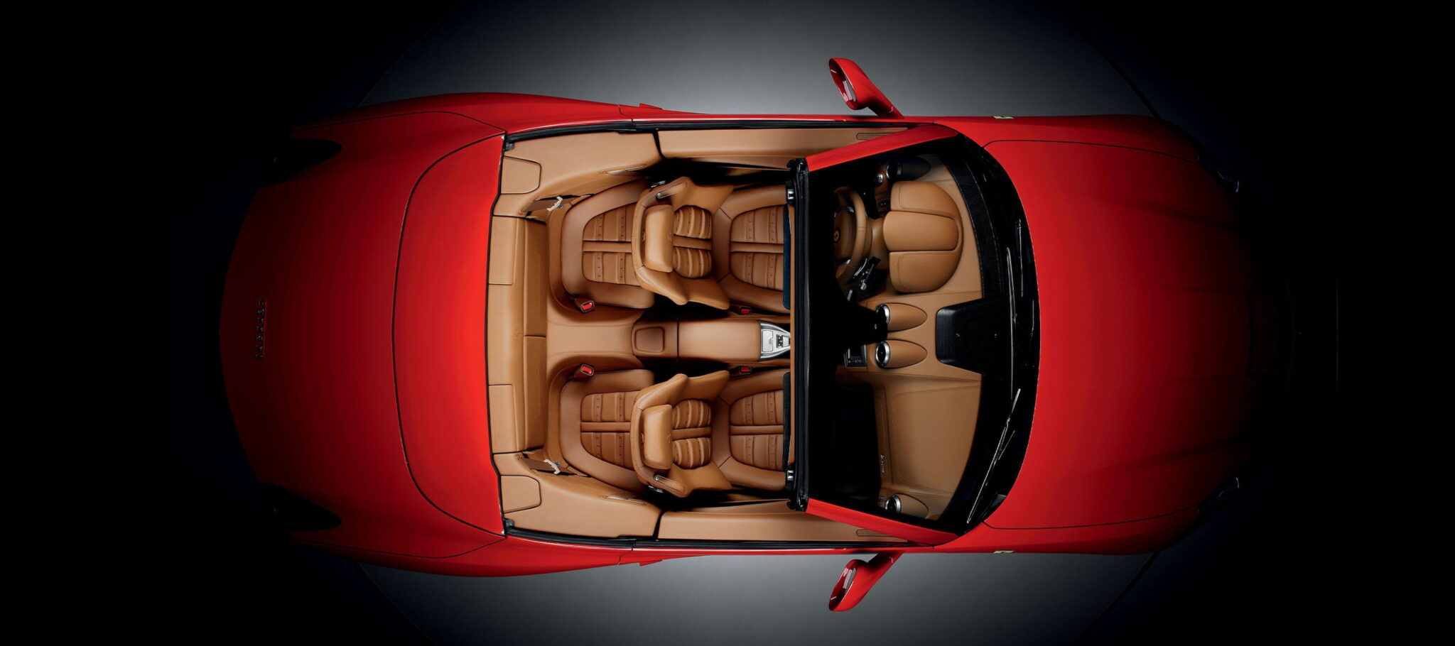 Top view of a car interior with tan leather seats, representing the automotive sector