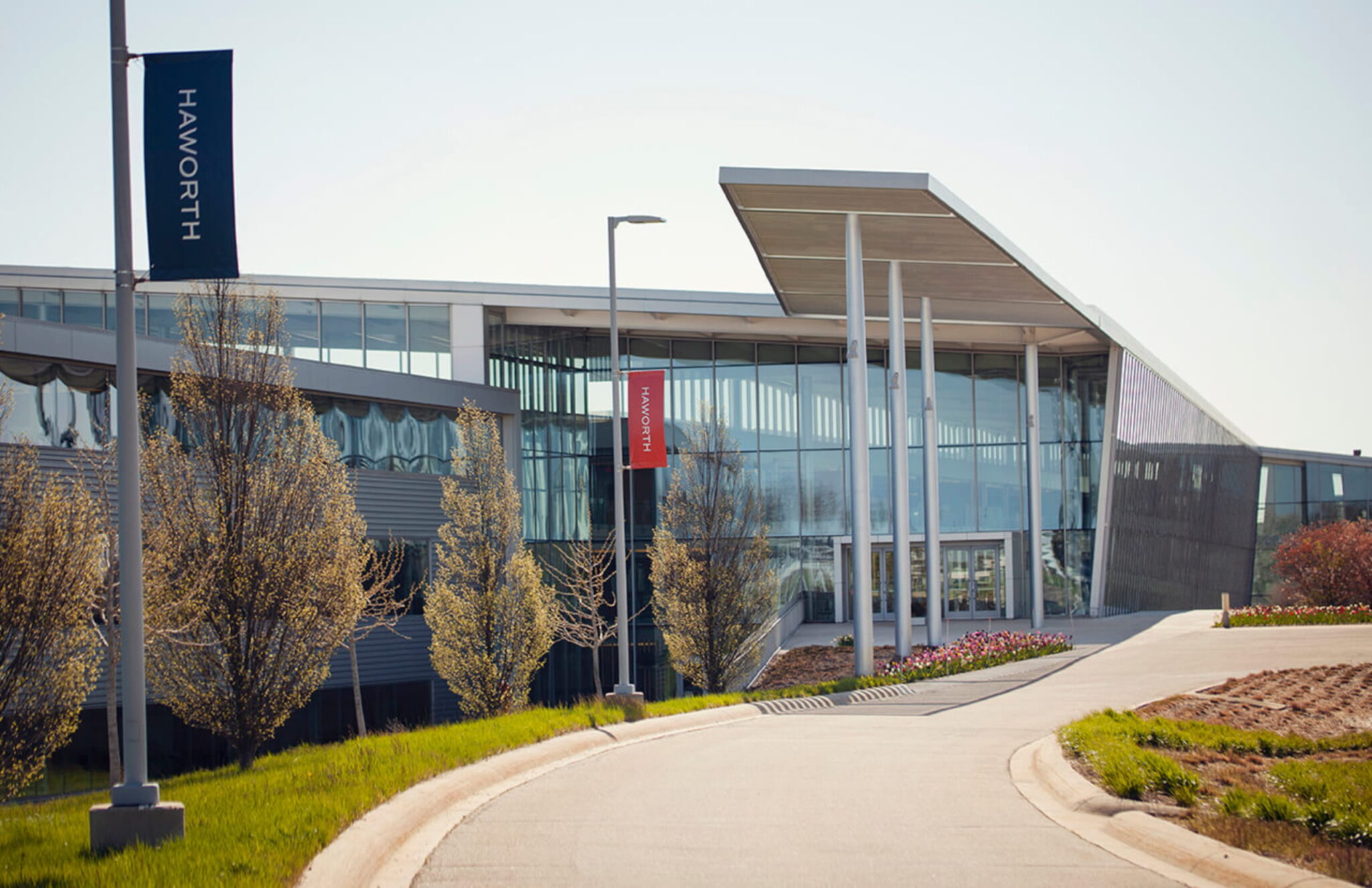 Exterior of the Haworth corporate building with modern architecture and landscaped entrance