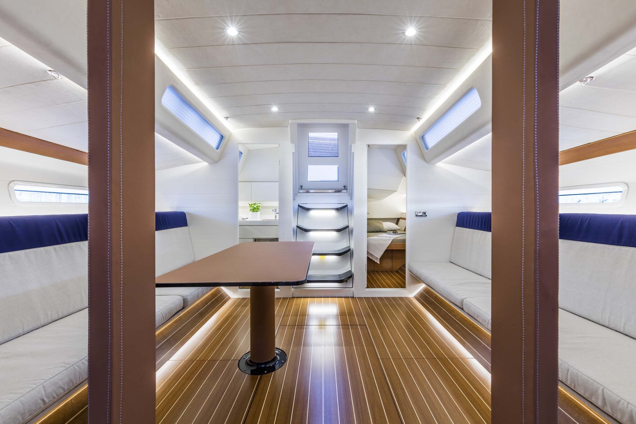 ClubSwan 50 yacht interior featuring a dining area with wood finishes