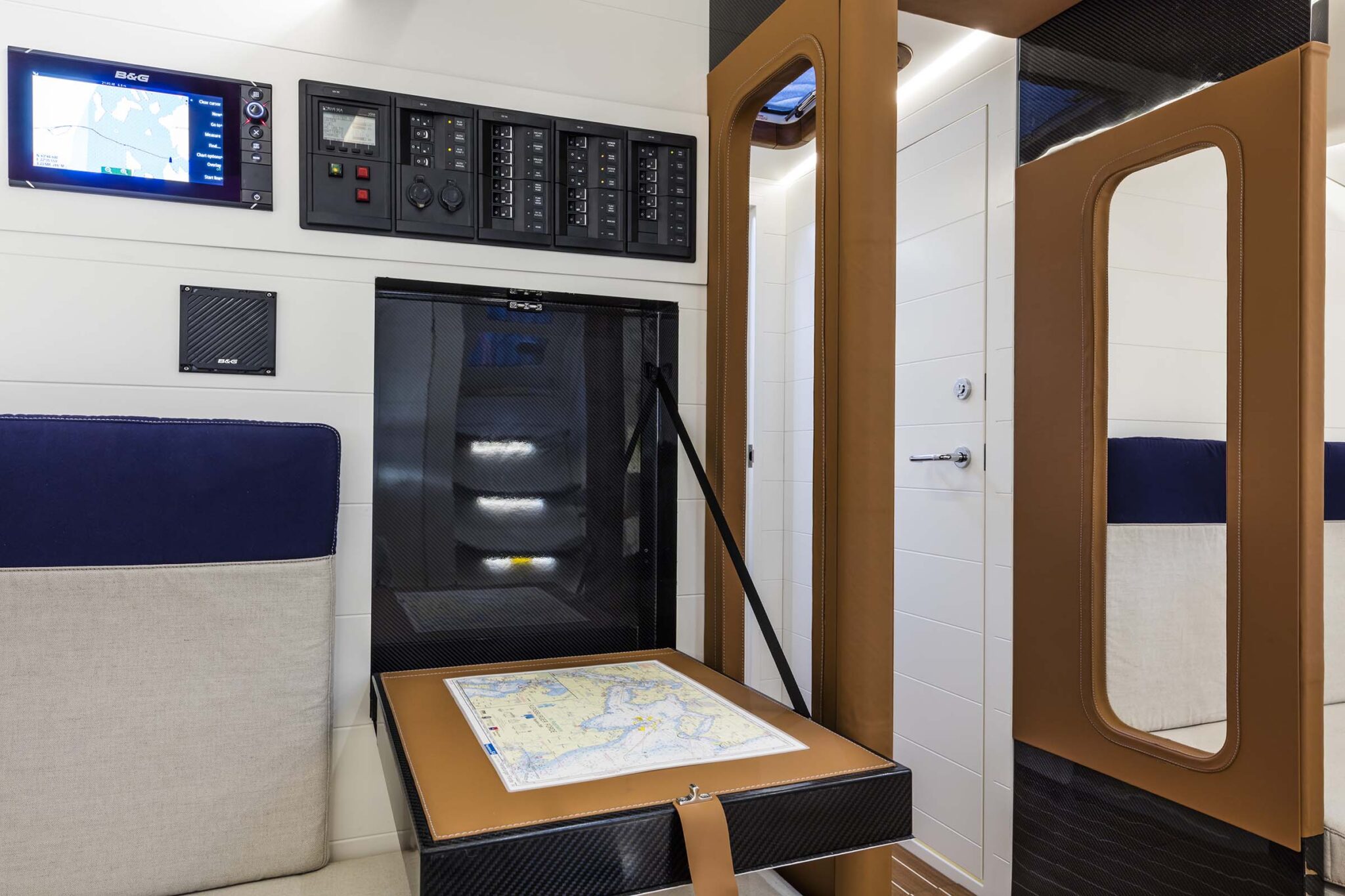 Navigation station aboard the ClubSwan 50 yacht with digital instruments