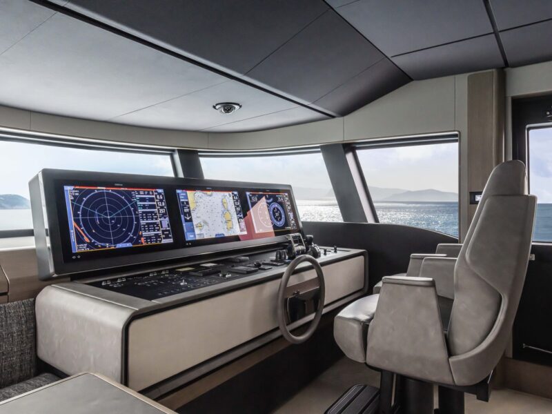 Helm station of the Fipa Infynito 90 yacht with Poltrona Frau In Motion interiors
