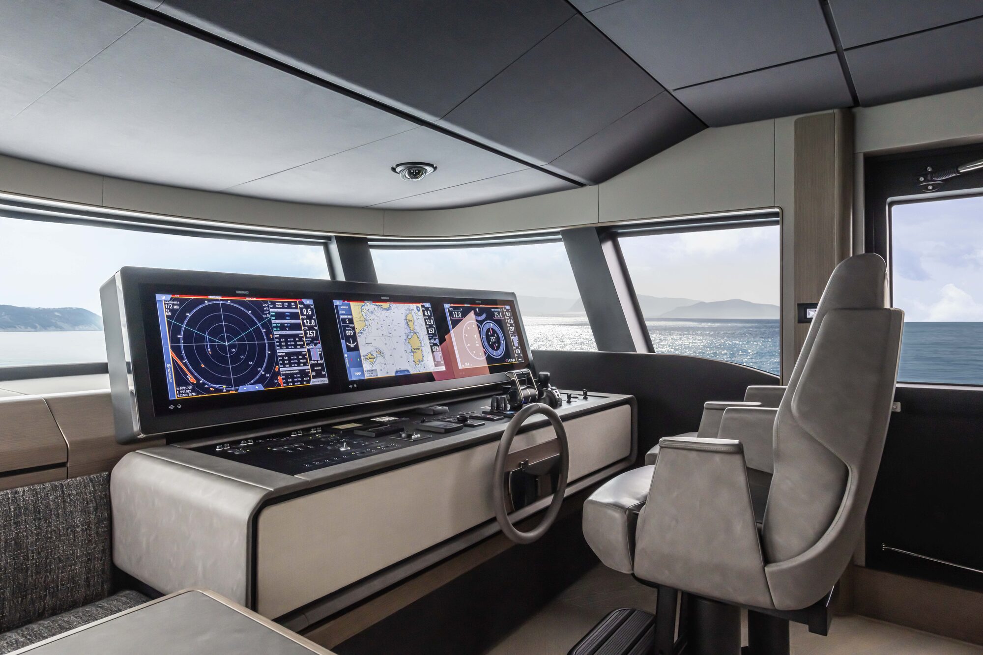 Helm station of the Fipa Infynito 90 yacht with Poltrona Frau In Motion interiors