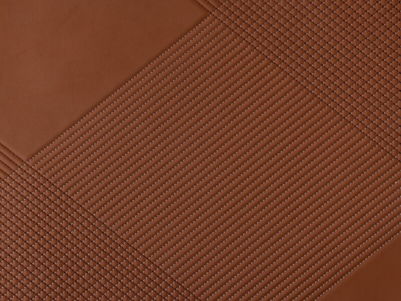 Detail of rust leather with diagonal crosshatch stitching pattern