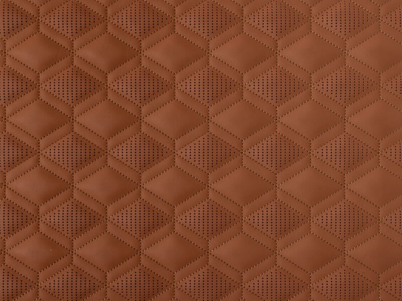 Detail of rust leather with perforated diamond pattern