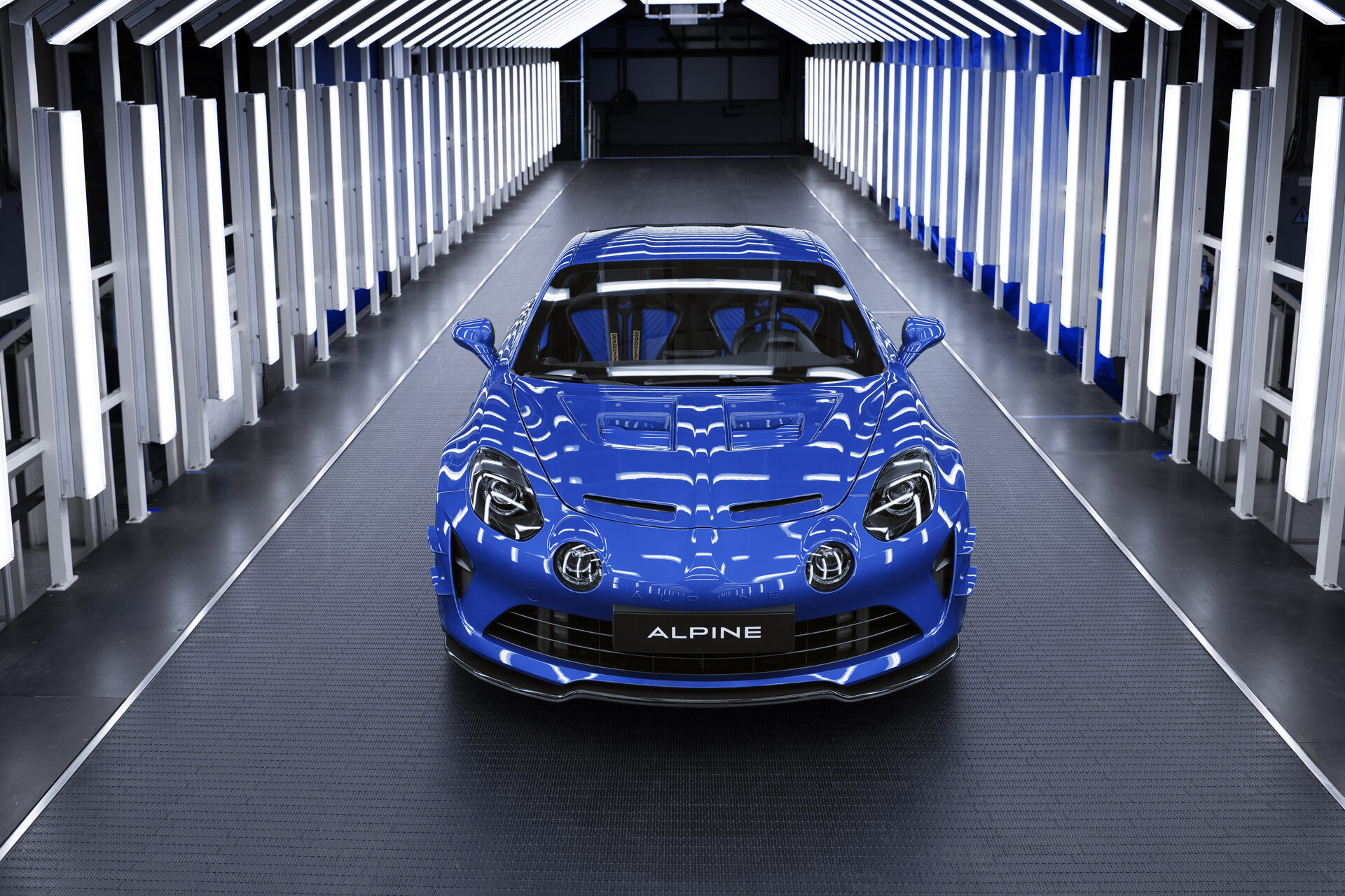 Blue Alpine A110R Ultime, front view in the paint inspection tunnel with LED lighting