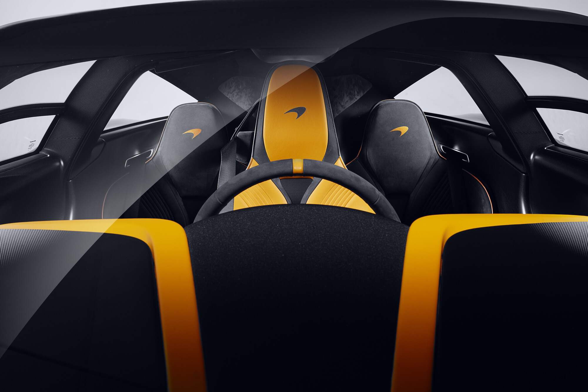 Overhead view of the McLaren Speedtail cabin with black and papaya yellow leather seats