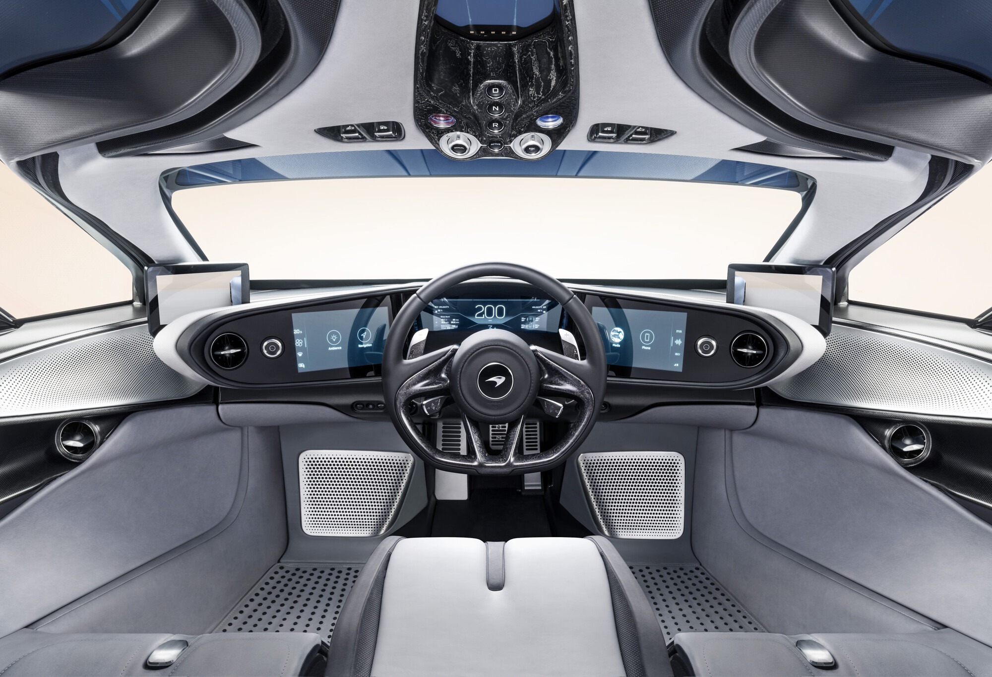 Front view of the McLaren Speedtail cockpit with digital dashboard and black leather steering wheel