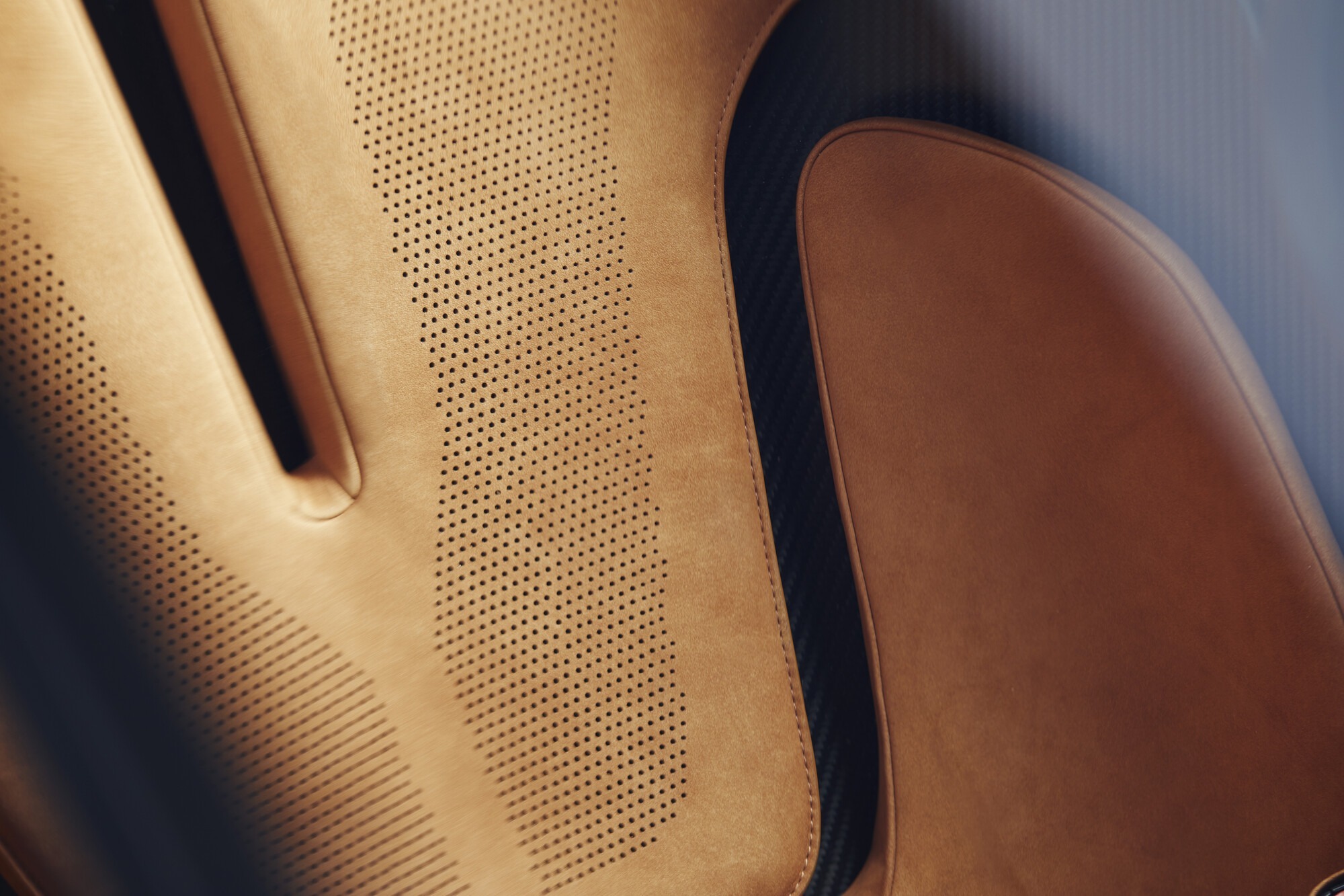 Detail of the perforated tan leather upholstery on the McLaren Speedtail seats