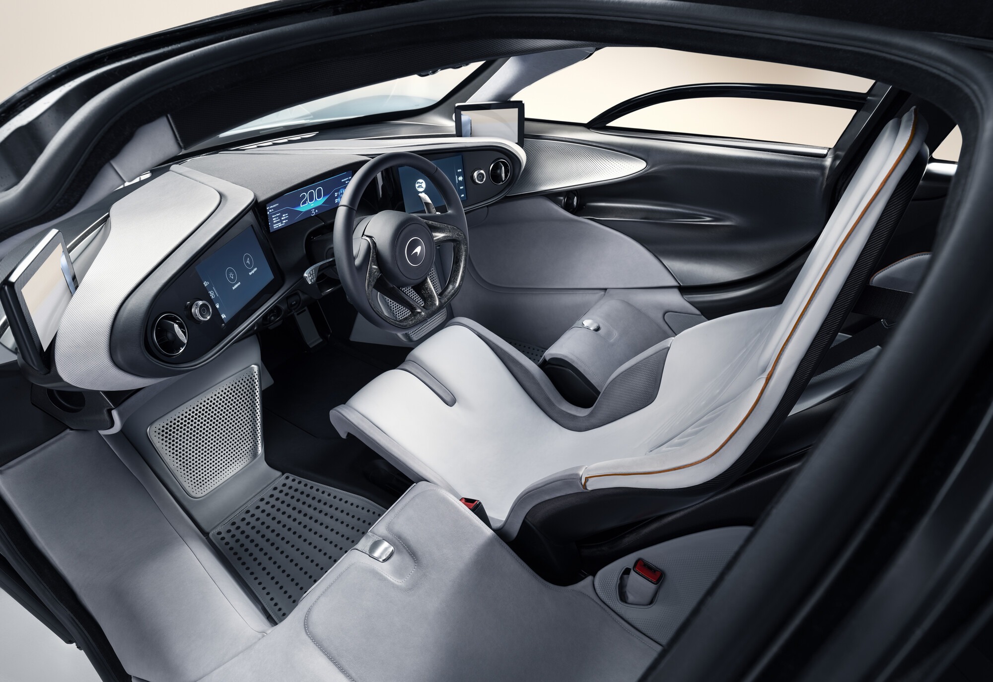Side view of the McLaren Speedtail's central driving seat, white leather and digital dashboard
