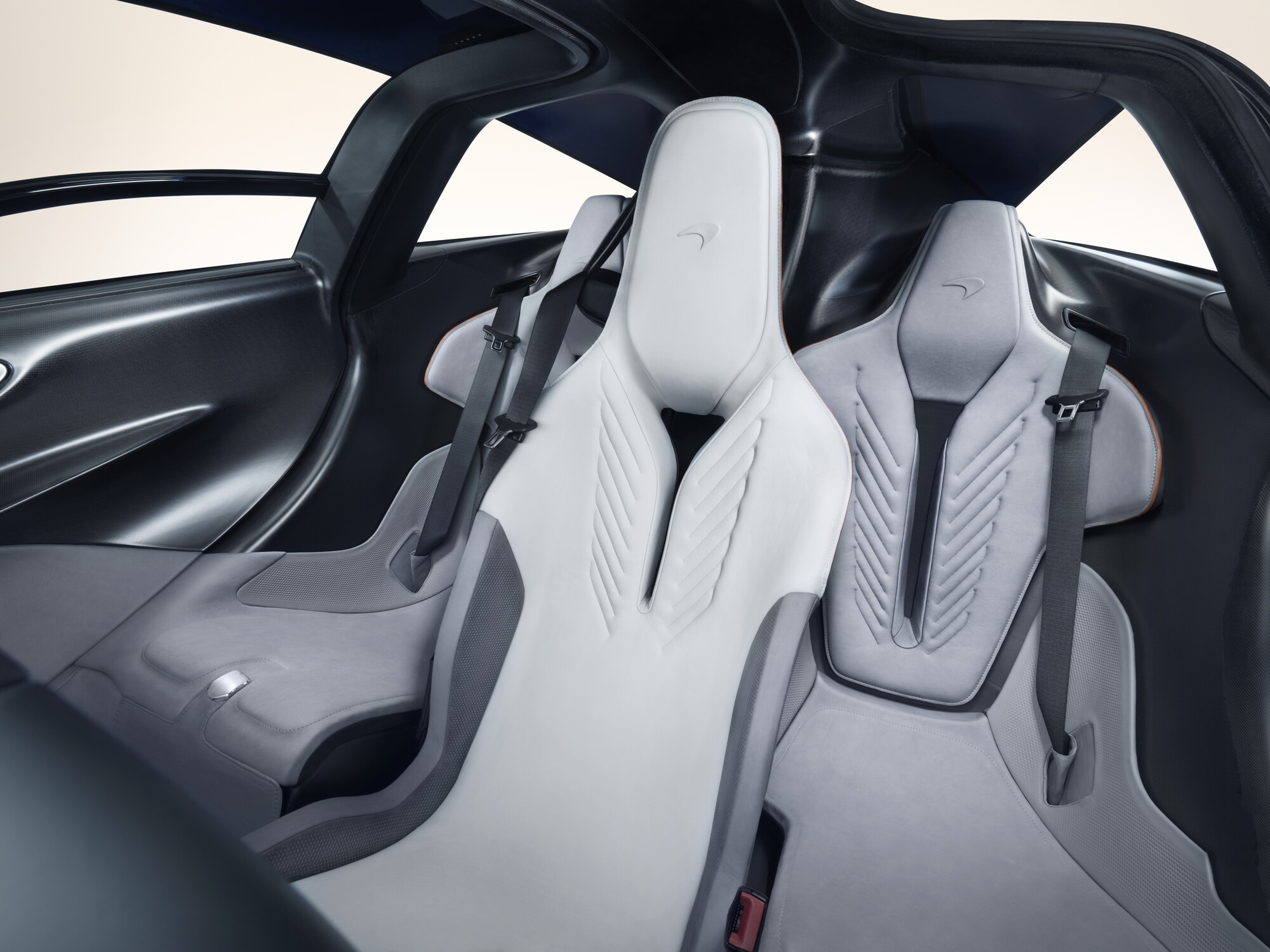 Detail of the McLaren Speedtail's rear seats in white and grey leather, front view