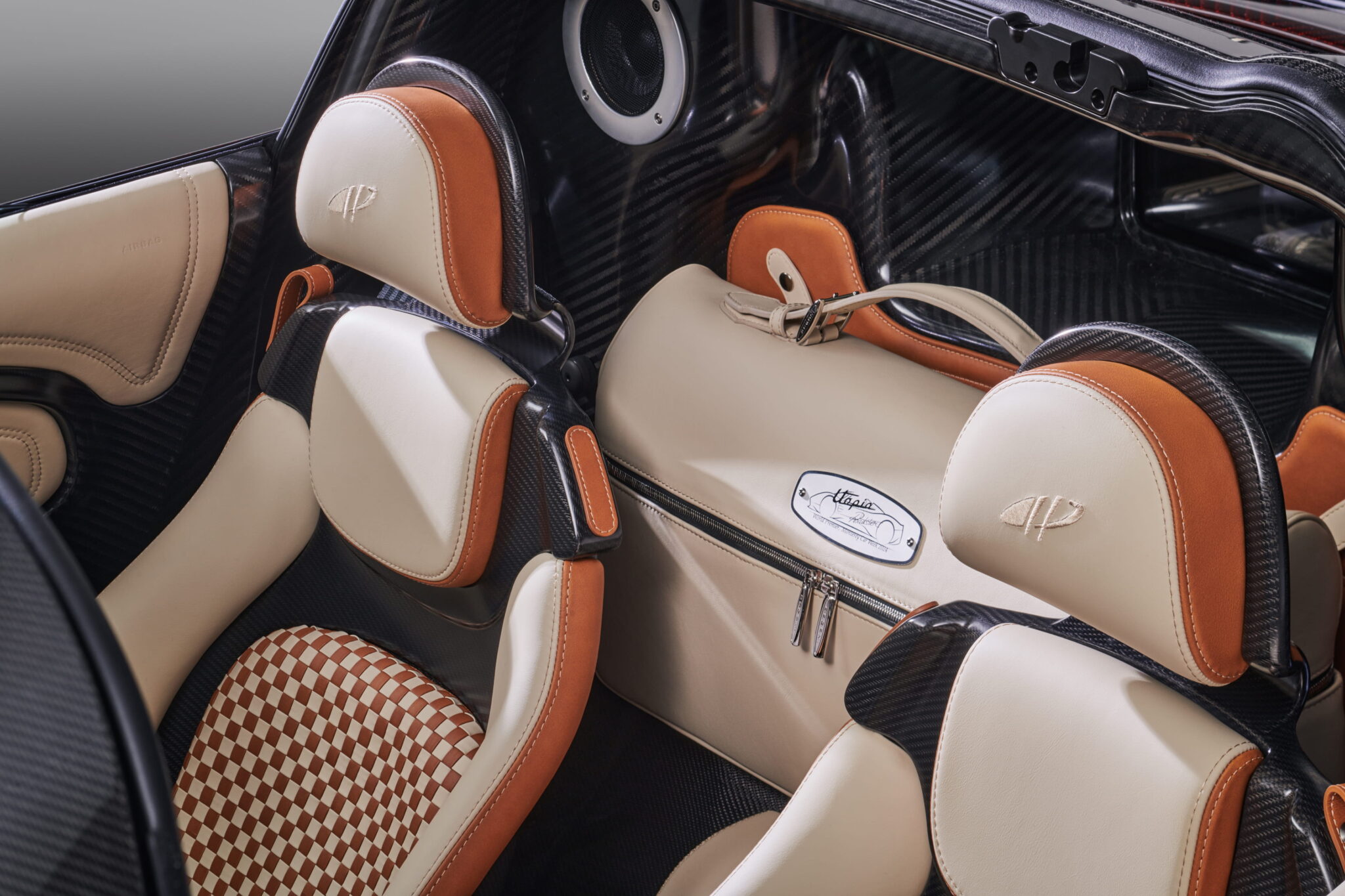 Pagani Utopia Roadster seats in two-tone leather with a branded Utopia holdall
